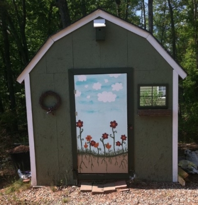 i hand painted my shed door to give it a little more charm