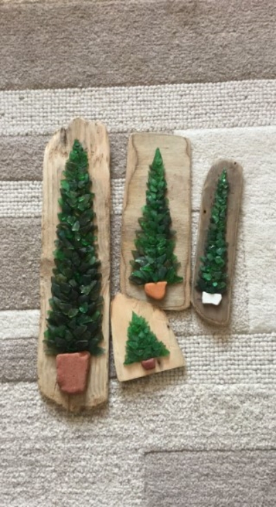 Christmas trees on driftwood