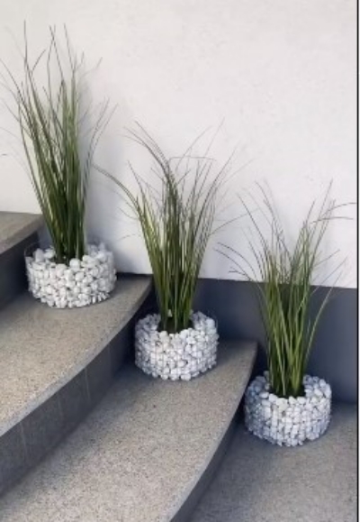 simple rock and wire frame outdoor planters