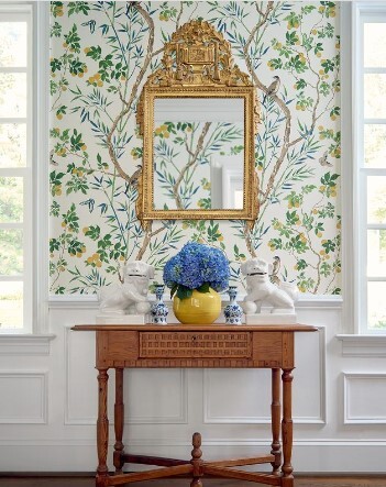 Foyer with tropical wallpaper and gold accents