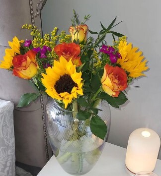 Bright and yellow sunflowers in a glass vase