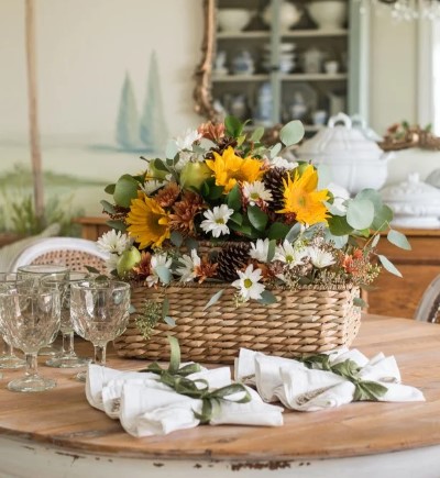 Tiered basket arrangement with a combination of silk flowers